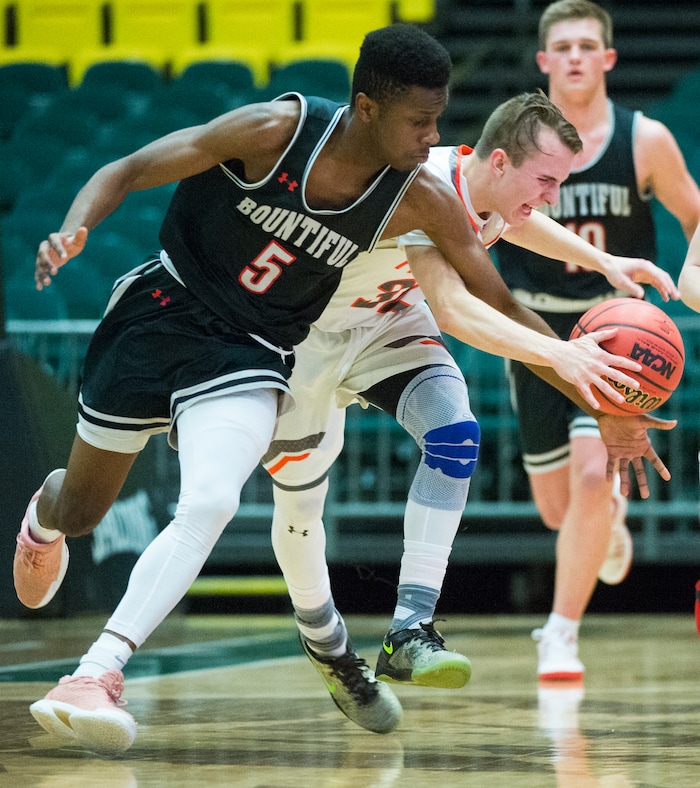 (Rick Egan  |  The Salt Lake Tribune)   Bountiful Braves Jaxon Wood (5) steals the ball from Skyridge Falcons Joe White (32), in 5A basketball playoff action between the Bountiful Braves and Skyridge Falcons, at the UCCU Center in Orem, Monday, Feb. 26, 2018.
