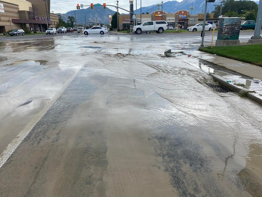 (South Salt Lake Police) A water main broke on 3300 South in South Salt Lake, causing a sinkhole and some partial road closures.