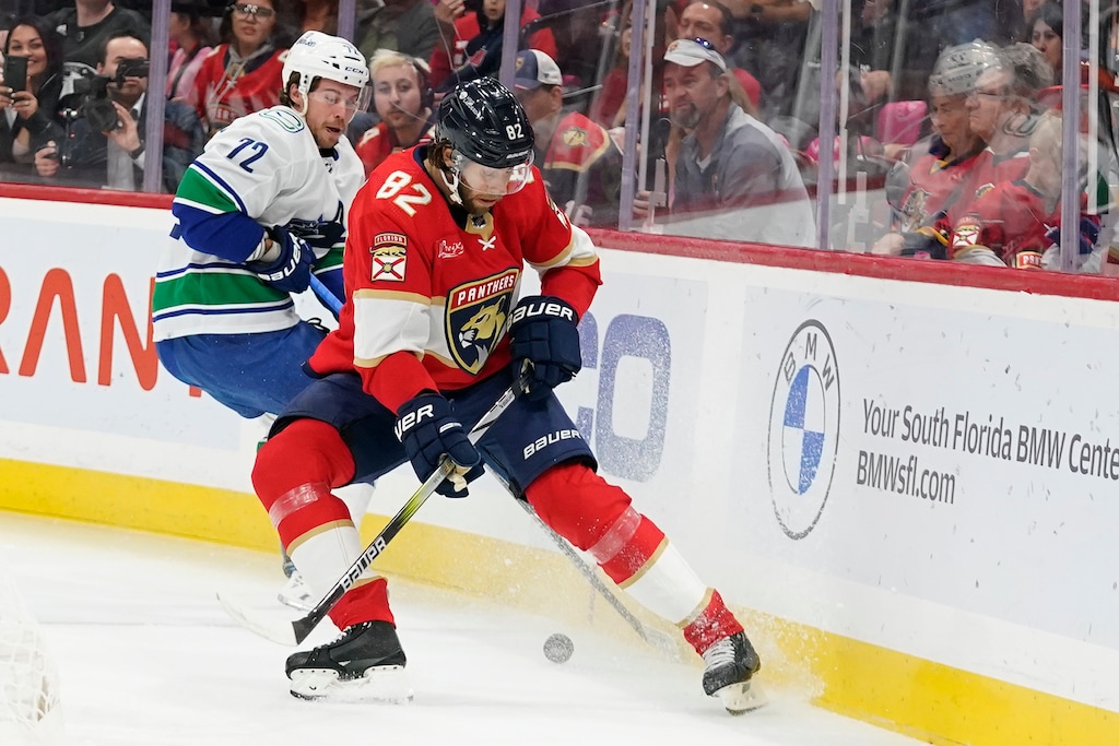 (Wilfredo Lee | AP) Former Florida Panthers center Kevin Stenlund (82) and Vancouver Canucks left wing Anthony Beauvillier (72) battle for the puck during the first period of a game on Oct. 21, 2023, in Sunrise, Fla. With Stanley Cup experience on his resume, Stenlund joins a Utah Hockey Club team looking to break into the playoffs this season.