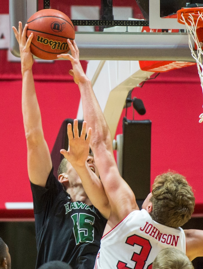 (Rick Egan  |  The Salt Lake Tribune)  Utah Utes forward Jayce Johnson (34) blocks a shot by Hawaii Warriors center Ido Flaisher (15), in basketball action, Utah Utes vs Hawaii Warriors, at the Jon M. Huntsman Center, Saturday, December 2, 2017.