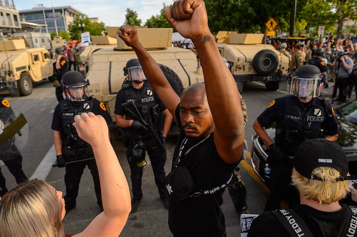 (Trent Nelson  |  The Salt Lake Tribune) Protesters in front of police during a protest against police brutality in Salt Lake City on Monday, June 1, 2020.