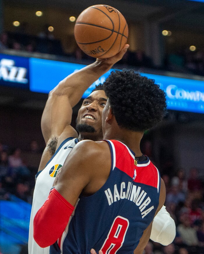 (Rick Egan  |  The Salt Lake Tribune)  Utah Jazz guard Donovan Mitchell (45) goes in for a slam dunk as Washington Wizards forward Rui Hachimura (8)defends,  in NBA action between the Utah Jazz and the Washington Wizards, in Salt Lake City,
Friday, February 28, 2020