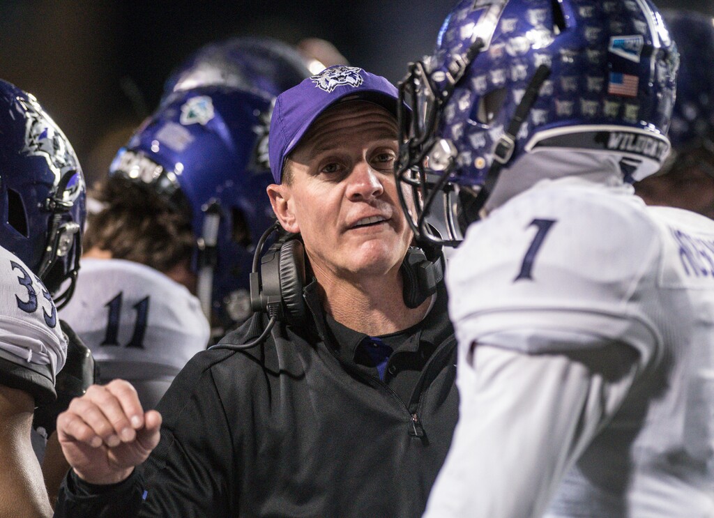 Weber State coach Jay Hill talks with safety Trey Hoskins (7) during the first half against James Madison in an NCAA college football game in the quarterfinals of the FCS playoffs Friday, Dec. 8, 2017, in Harrisonburg, Va. (Daniel Lin/Daily News-Record via AP)