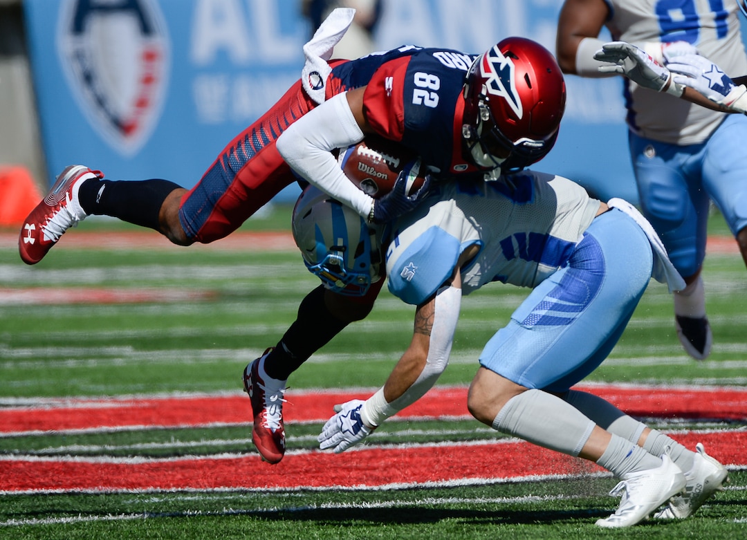 (Francisco Kjolseth  |  The Salt Lake Tribune)  Gerrard Sheppard #82 of the Memphis Express gets up ended by Cody Brown #21 of the Salt Lake Stallions as the Stallions host the Memphis Express of the Alliance of American Football in Salt Lake City on Saturday March 16, 2019.