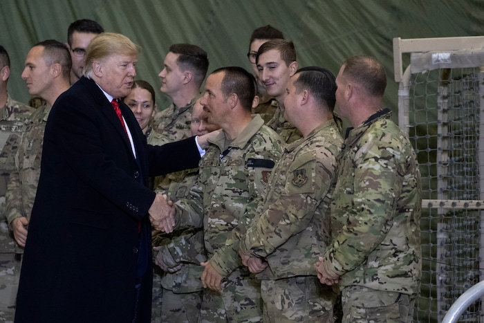 (Alex Brandon | AP) President Donald Trump greeting members of the military after speaking to members of the military during a surprise Thanksgiving Day visit, Thursday, Nov. 28, 2019, at Bagram Air Field, Afghanistan.