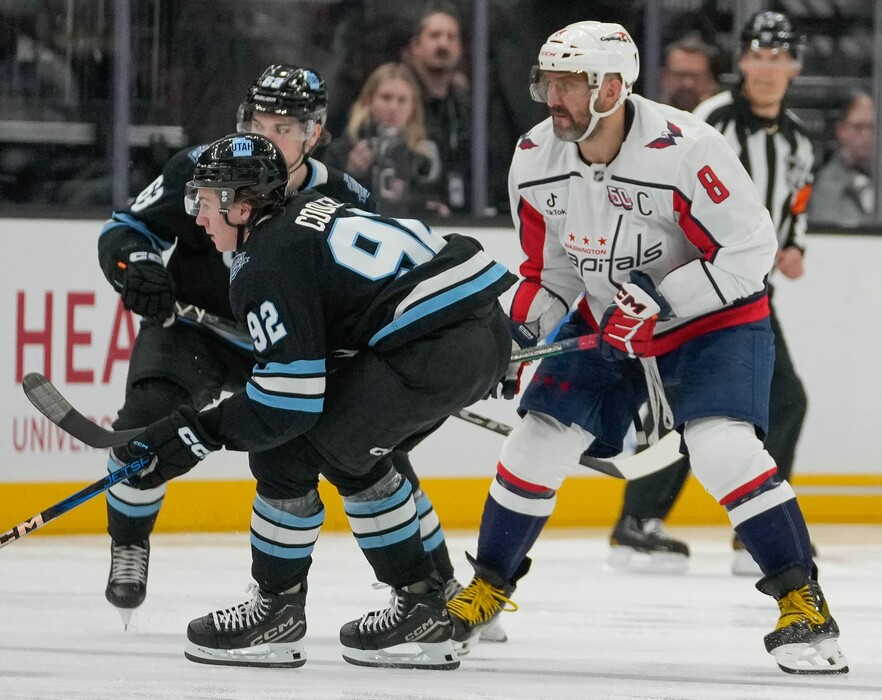 (Francisco Kjolseth  | The Salt Lake Tribune) Utah Hockey Club center Logan Cooley (92) skates alongside Washington Capitals left wing Alex Ovechkin (8) during an NHL hockey game at the Delta Center in Salt Lake City on Monday, Nov. 18, 2024.
