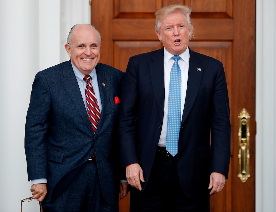 (Carolyn Kaster | Associated Press file photo) In this Nov. 20, 2016, file photo, then-President-elect Donald Trump, right, and former New York Mayor Rudy Giuliani pose for photographs as Giuliani arrives at the Trump National Golf Club Bedminster clubhouse in Bedminster, N.J. Giuliani is joining the legal team defending President Donald Trump in the special counsel’s Russia investigation.