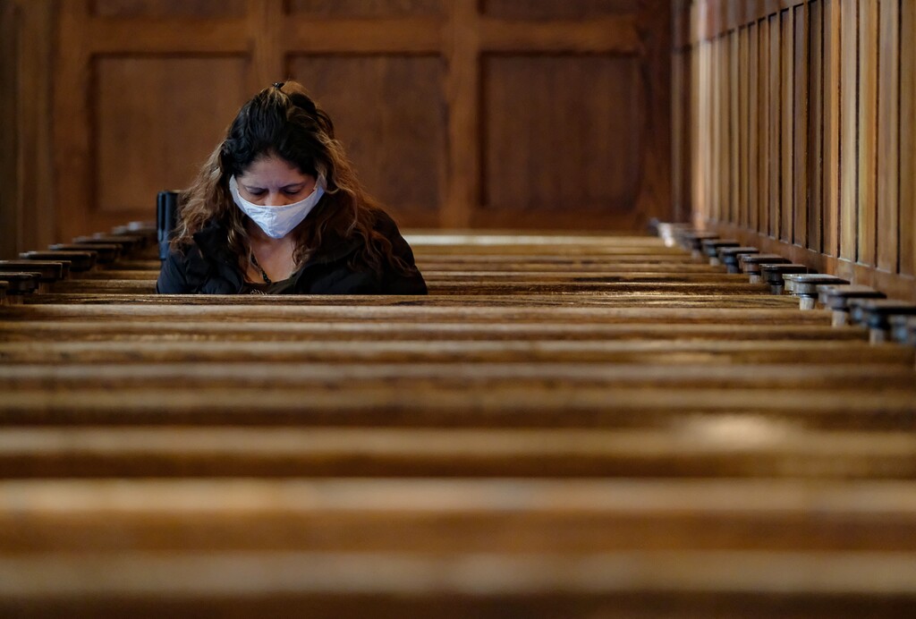(Francisco Kjolseth | The Salt Lake Tribune) Catholic parishioners observe morning daily Mass at Cathedral of the Madeleine in Salt Lake City on Friday, May 8, 2020, where a majority of the pews are taped off due to restrictions implemented to combat COVID-19.