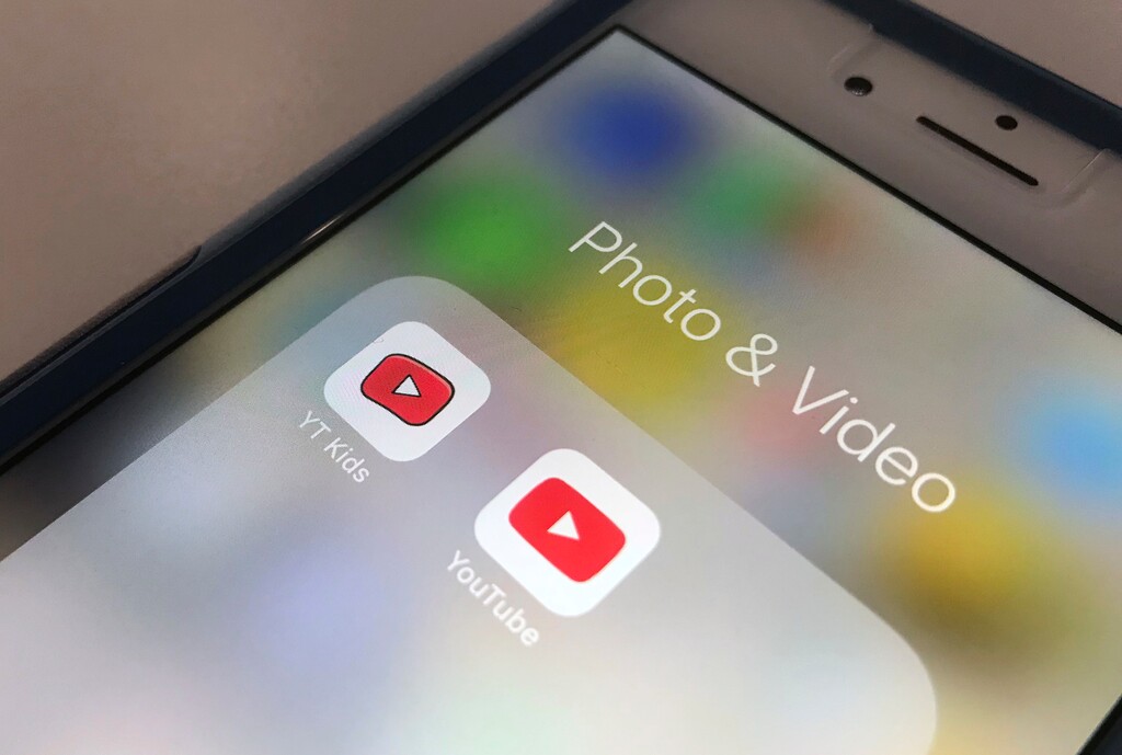 (AP Photo/Jenny Kane) The YouTube app and YouTube Kids app are displayed on an iPhone in New York. YouTube is overhauling its kid-focused video app to give parents the option of letting humans, not computer algorithms, select what shows their children can watch. The updates are a response to complaints that the YouTube Kids app has repeatedly failed to filter out disturbing content.