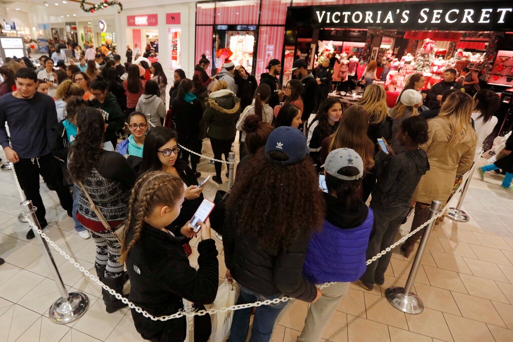 Shoppers queue up in front of Victoria's Secret at the Dartmouth Mall on Black Friday, in Dartmouth, Mass., Nov. 25, 2016. Stores open their doors Friday for what is still one of the busiest days of the year, even as the start of the holiday season edges ever earlier. (Peter Pereira/Standard Time/SCMGs via AP)
