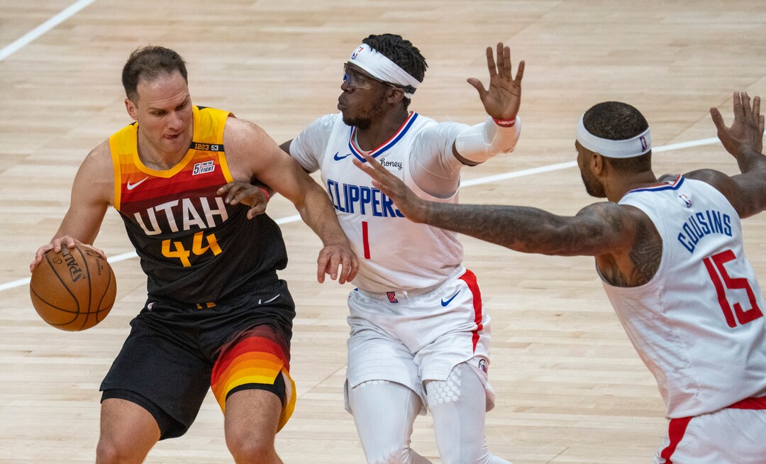(Rick Egan | The Salt Lake Tribune) Utah Jazz forward Bojan Bogdanovic (44) is guarded by LA Clippers guard Reggie Jackson (1) and LA Clippers center DeMarcus Cousins (15), in NBA action between the Utah Jazz and the LA Clippers, in game one in the second round of the NBA playoff series at Vivint Arena, on Tuesday, June 8, 2021.