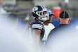 (Bethany Baker | The Salt Lake Tribune) Brigham Young Cougars head coach Kalani Sitake puts his arm around Cougars player Ephraim Asiata during a game in 2025. Asiata has been charged with DUI.