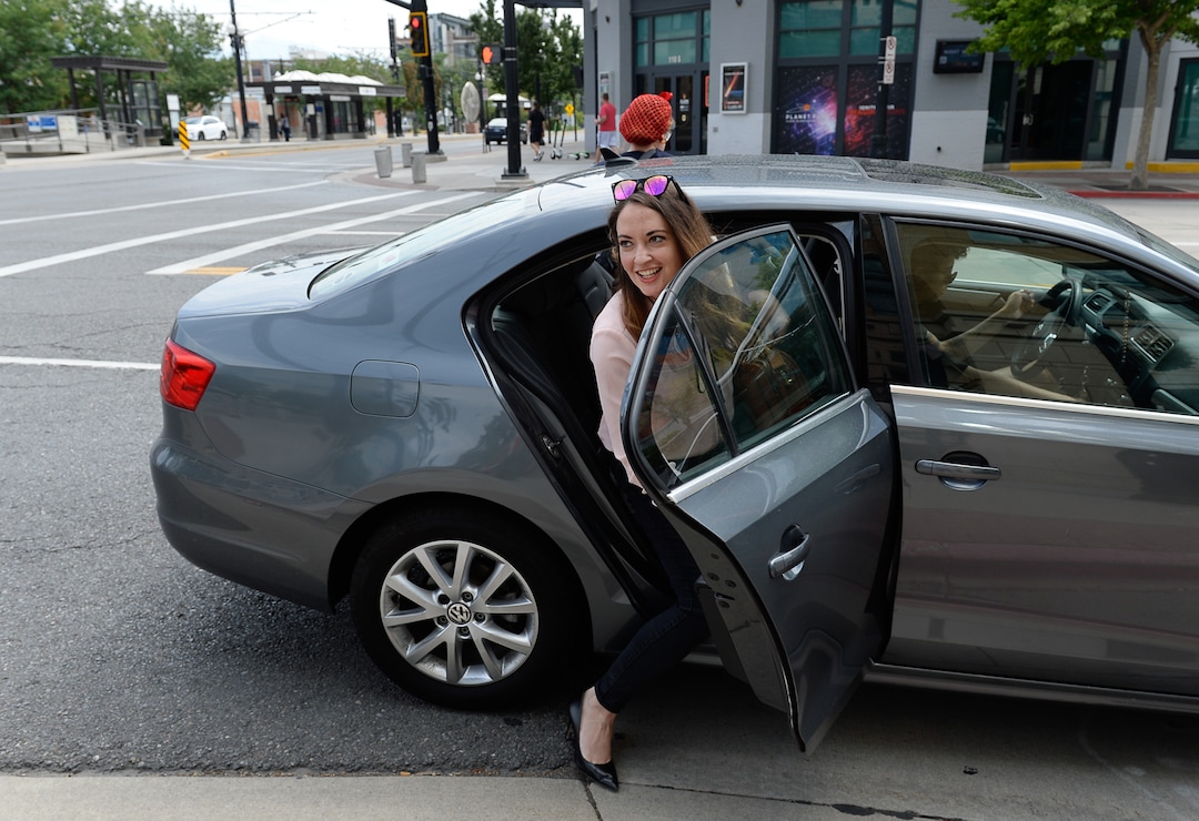 (Francisco Kjolseth  |  The Salt Lake Tribune)  Salt Lake Tribune Digital News Editor Rachel Piper finishes her race against colleagues after taking Lyft during a downtown transportation race from Library Square to the Tribune building at the Gateway on Thursday, Aug. 2, 2018. Modes of transportation included, rentable electric scooters, Green Bike, TRAX, Lyft, and walking.