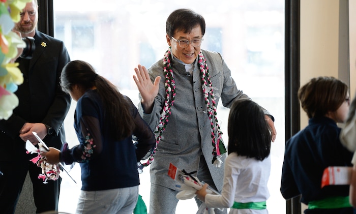 (Francisco Kjolseth | The Salt Lake Tribune) Jackie Chan gives high fives to Mountain View Elementary students following a workshop as part of a preview of Jackie ChanÕs Inaugural Environmental Exhibition ÔJackie Chan: Green HeroÕ at The Leonardo: Museum of Creativity and Innovation on Thursday, Jan. 24, 2019.