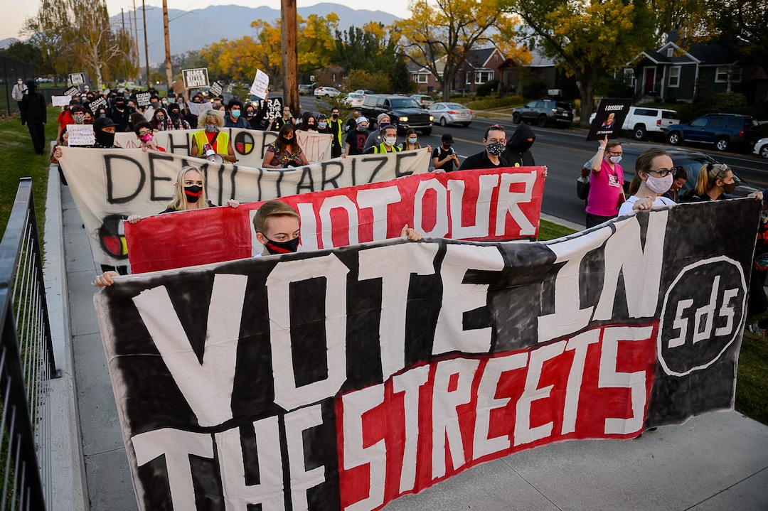 (Trent Nelson  |  The Salt Lake Tribune) Protesters march as Vice President Mike Pence and Sen. Kamala Harris prepare to debate at Kingsbury Hall in Salt Lake City on Wednesday, Oct. 7, 2020.