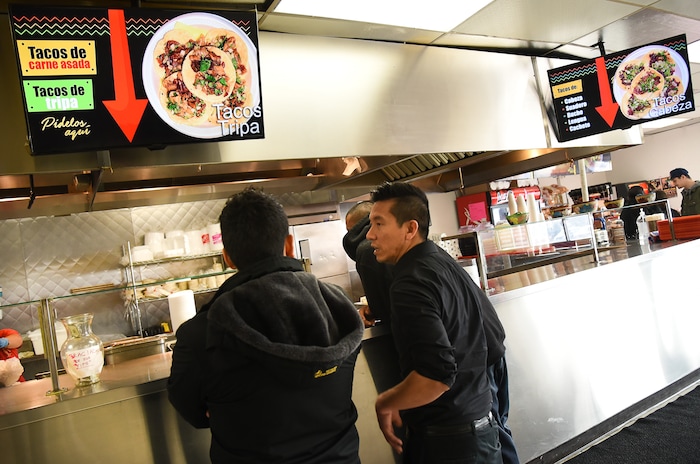 (Francisco Kjolseth  |  The Salt Lake Tribune)  Customers line up according to the type of taco they would like to order at Tacos Mi Caramelo, a late-night taqueria that is open until 2 a.m. most nights and 24-hours a day on Friday and Saturday.