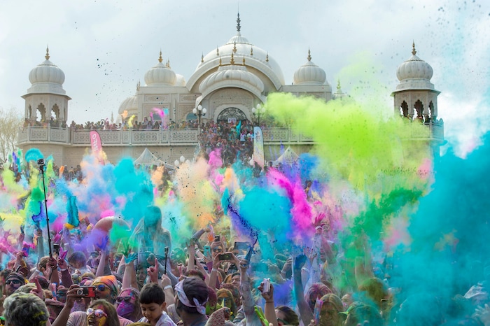 (Rick Egan  |  The Salt Lake Tribune)   Revelers toss colored powder into the air as they celebrate the arrival of spring, during the Holi Festival of Colors celebration at the Sri Sri Radha Krishna Temple in Spanish Fork, Saturday, March 30, 2019.


