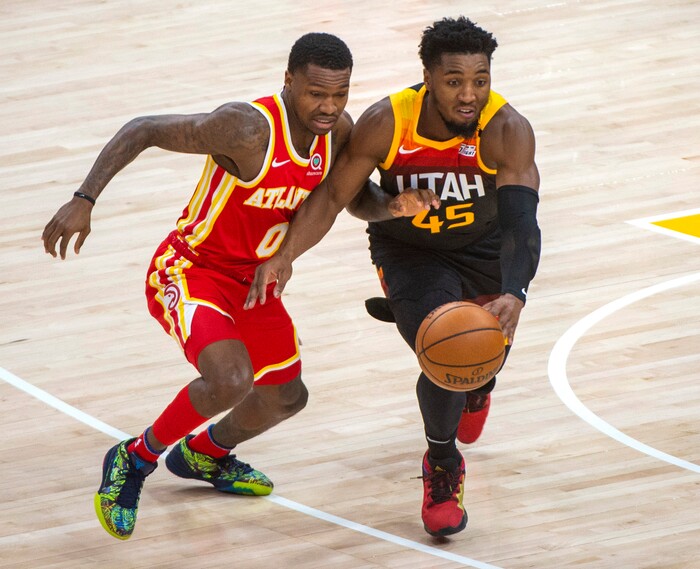 (Rick Egan | The Salt Lake Tribune) Utah Jazz guard Donovan Mitchell (45) knocks the ball out of the hands of Atlanta Hawks guard Brandon Goodwin (0), in NBA action between the Utah Jazz and the Atlanta Hawks at Vivint Arena, on Friday, Jan. 15, 2021.