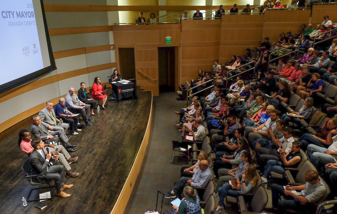 (Francisco Kjolseth  |  The Salt Lake Tribune)  All eight of the candidates for Salt Lake City mayor gather for a debate at the Salt Lake City Library on Wed. June 26, 2019, which includes, from left, David Garbett, Abi Olufeko standing in for Rainer Huck, David Ibarra, Jim Dabakis, Richard Goldberger, Stan Penfold, Erin Mendenhall and Luz Escamilla. The debate was hosted by the ABU Education Fund and the University of Utah’s John R. Park Debate Society and moderated by Averie Vockel.