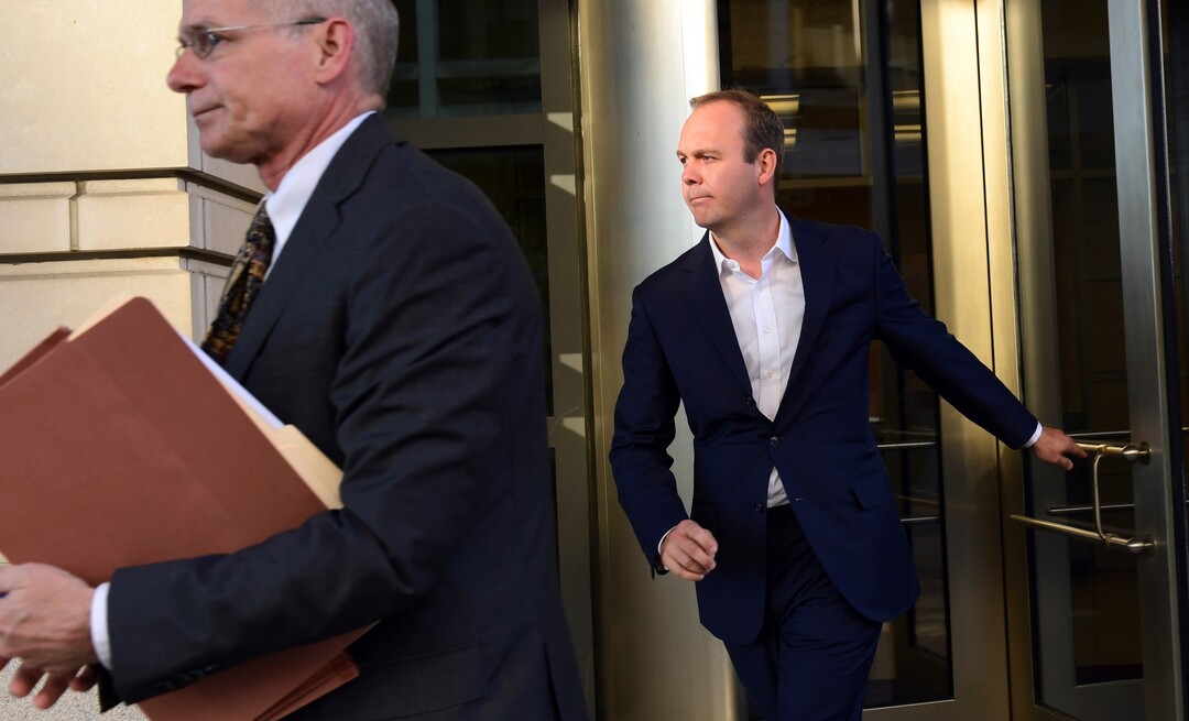 Rick Gates, right, leaves federal court in Washington, Monday, Oct. 30, 2017. Paul Manafort, President Donald Trump's former campaign chairman, and Manafort's business associate Gates pleaded not guilty to felony charges of conspiracy against the United States and other counts. (AP Photo/Susan Walsh)