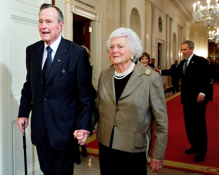 (AP Photo/Manuel Balce Ceneta, File) In this Jan. 7, 2009, photo, former President George H. W. Bush, left, walks with his wife, former first lady Barbara Bush, followed by their son, President George W. Bush, and his wife first lady Laura Bush, to a reception in honor of the Points of Light Institute, in the East Room at the White House in Washington.