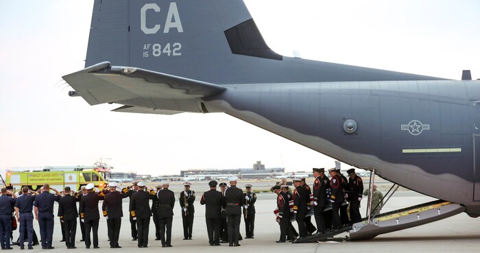 (Steve Griffin  |  Deseret News, pool photo)  Members of the Draper City Fire Department and Unified Fire Authority Honor Guard carry the  casket of Draper Battalion Chief Matt Burchett to a hearse after being transported from California to Utah in a C130-J by the California Air National Guard. The C130-J landed at the Utah Air National Guard Base in Salt Lake City on Wednesday, Aug. 15, 2018. Burchett was killed while fighting the Mendocino Complex Fire north of San Francisco.