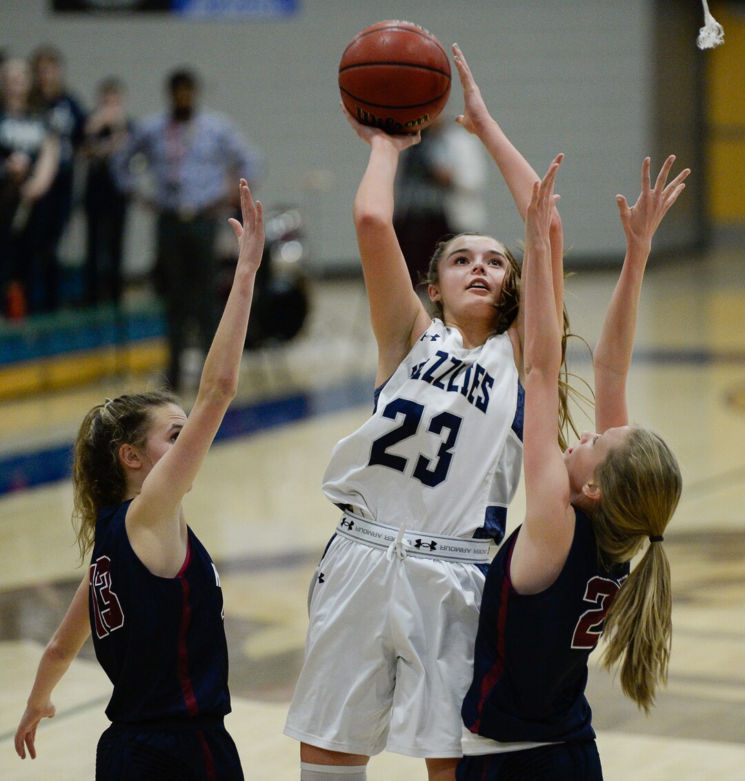 (Francisco Kjolseth  |  The Salt Lake Tribune)  Breaunna Gillan of Copper Hills finds her mark over Herriman in West Jordan on Thursday, Jan. 25, 2018.