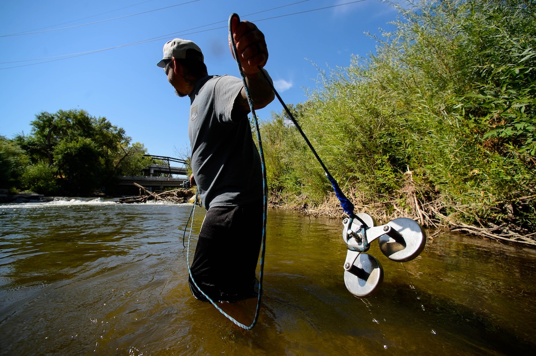 (Trent Nelson  |  The Salt Lake Tribune)  
Remo Martinez magnet fishing the Weber River on Saturday Aug. 31, 2019. Volunteers assisted the Utah Cold Case Coalition, hoping to find evidence in several cases.