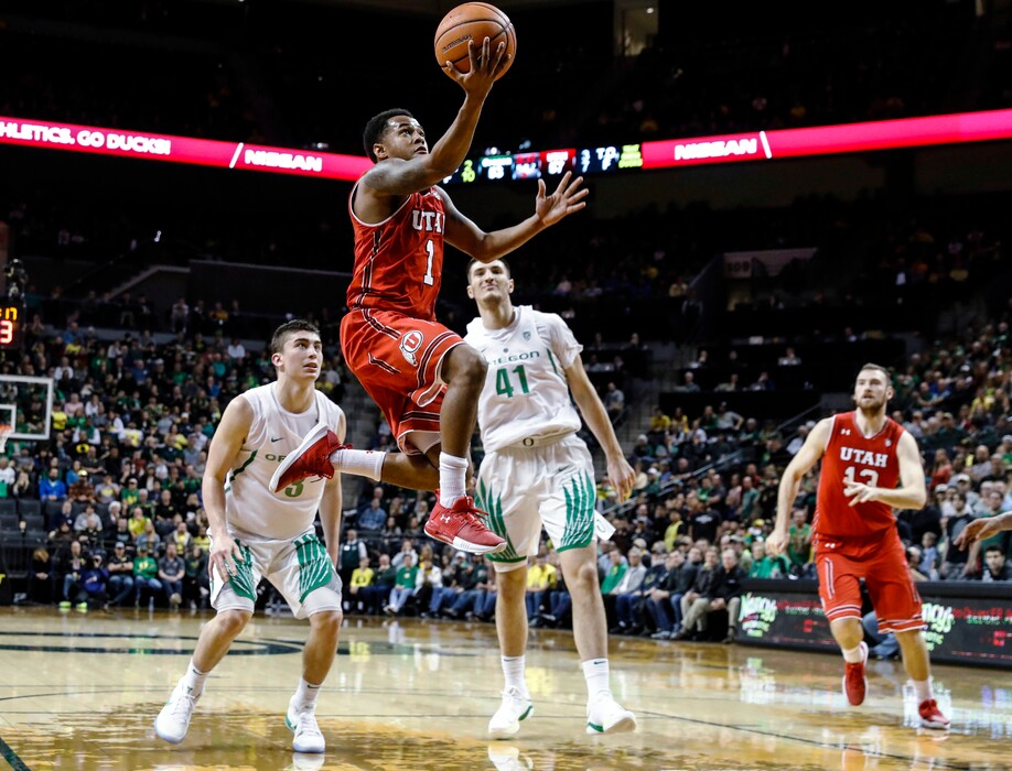Utah guard Justin Bibbins (1) drives to the basket against Oregon during an NCAA college basketball game Friday, Dec. 29, 2017, in Eugene, Ore. (AP Photo/Thomas Boyd)