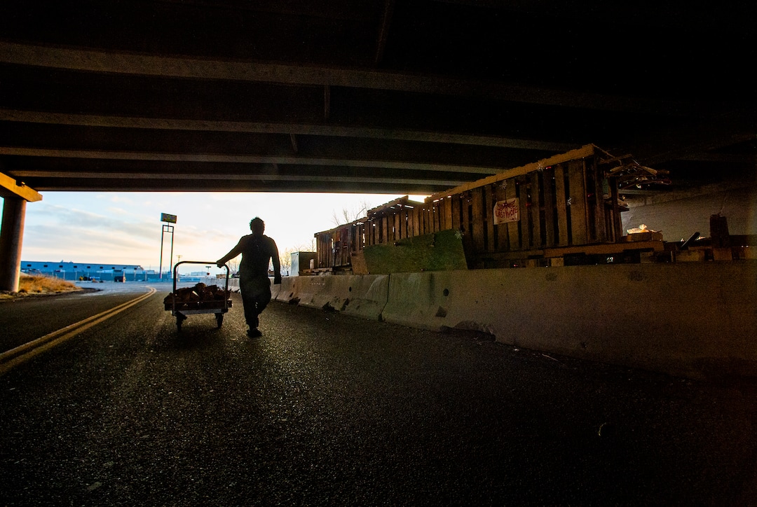 3(Rick Egan | The Salt Lake Tribune) A man brings a cart full of firewood to his camping area at Camp Last Hope onFriday, Jan. 1, 2021.
