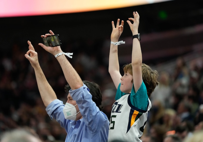 (Francisco Kjolseth | The Salt Lake Tribune) The fans go wild as Utah Jazz forward Royce O'Neale (23) drops a three point shot in NBA action between the Utah Jazz and the LA Clippers at Vivint Smart Home Arena in Salt Lake City, Wednesday, Dec. 15, 2021.