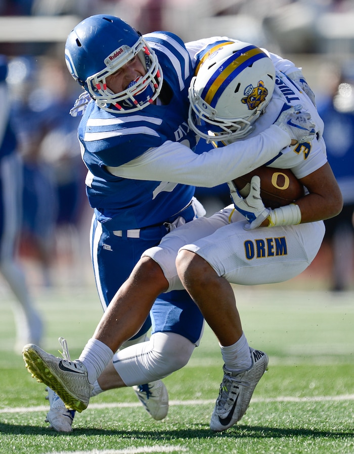 (Francisco Kjolseth  |  The Salt Lake Tribune)  Dixie's Jake Staheli puts the pressure on Buju Tuisavura of Orem in the 4A high school championship game at Rice Eccles Stadium in Salt Lake City, Friday, Nov. 16, 2018.
