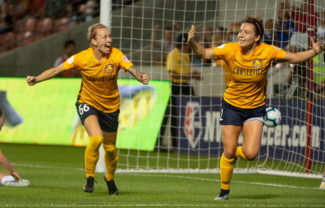 (Rick Egan  |  The Salt Lake Tribune)    Utah Royals FC midfielder Gunnhildur Jónsdóttir (66) celebrates after Utah Royals FC defender Rachel Corsie (2) scored the game tying goal, in Soccer action between Utah Royals FC and Portland Thorns FC, in Sandy, Friday, July 19, 2019.