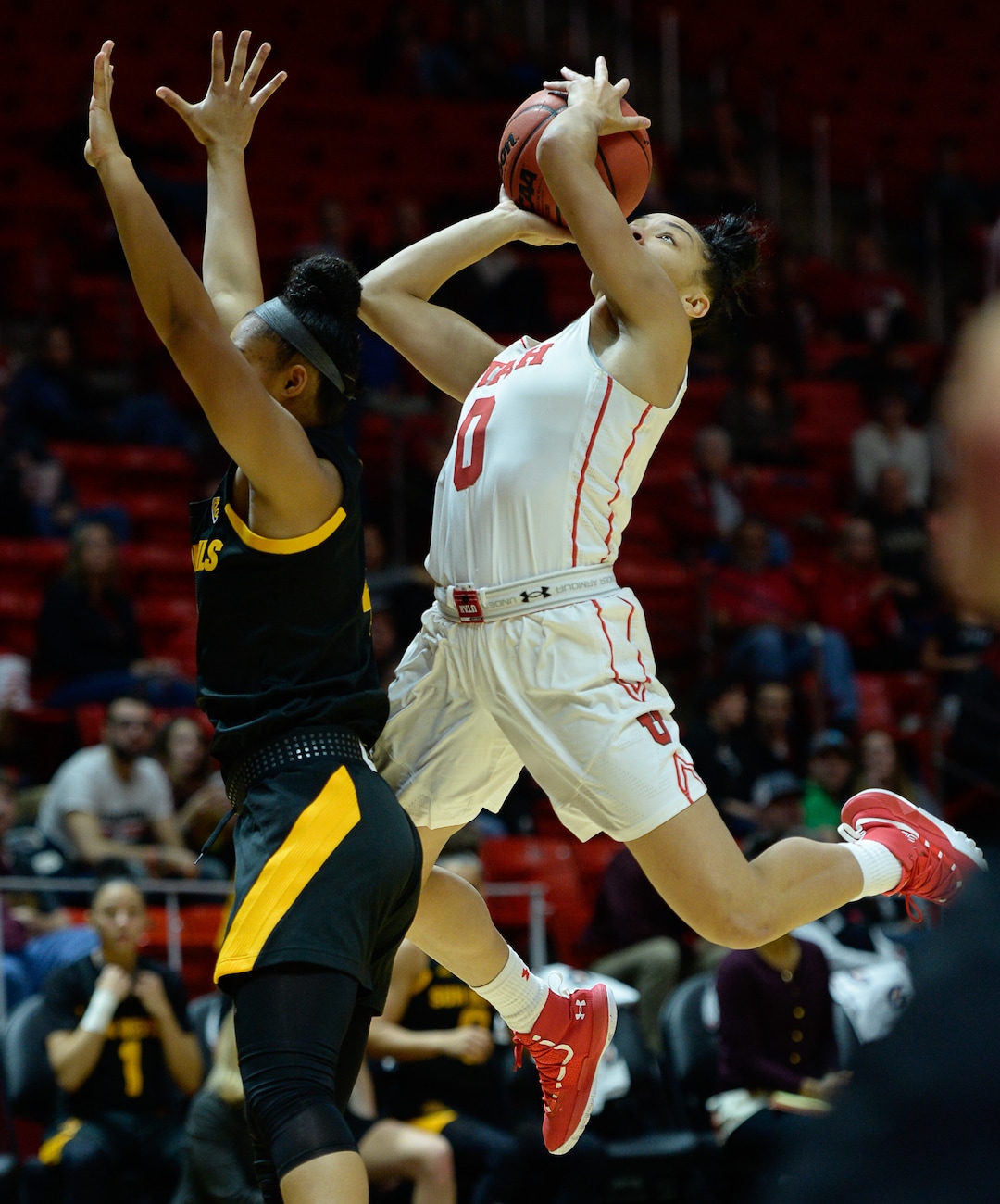 (Francisco Kjolseth  |  The Salt Lake Tribune)  Utah Utes guard Kiana Moore (0) lays one up over ASU in Utes' Pac-12 home opener at the Jon M Huntsman Center on Friday, Jan. 4, 2019. They're off to one of their best starts in team history.