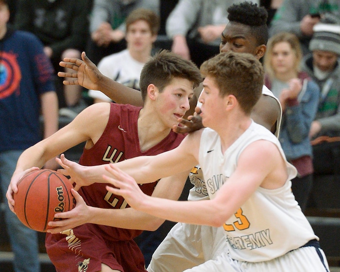 (Leah Hogsten  |  The Salt Lake Tribune) Juab's Jackson Rowley tries to slip past Summit Academy's Edgar Wilson. Juab High School boys' basketball team defeated Summit Academy 61-58 during their 3A State tournament game in Heber Saturday, Feb. 17, 2018.