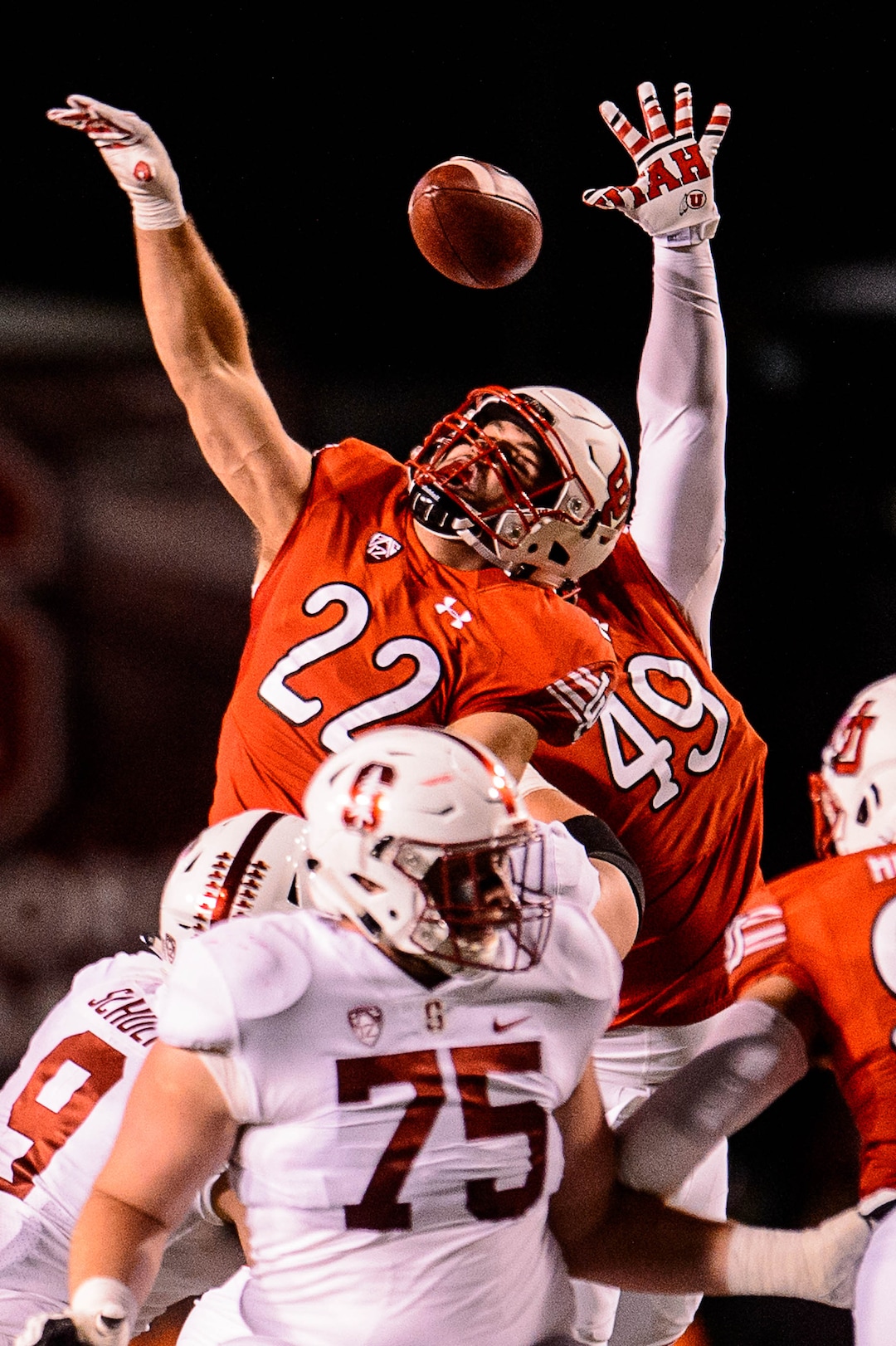 (Trent Nelson | The Salt Lake Tribune)  Utah Utes defensive back Chase Hansen (22) and Utah Utes defensive tackle Pita Tonga (49) reach for a Stanford pass as the University of Utah hosts Stanford, NCAA football at Rice-Eccles Stadium in Salt Lake City Saturday October 7, 2017.