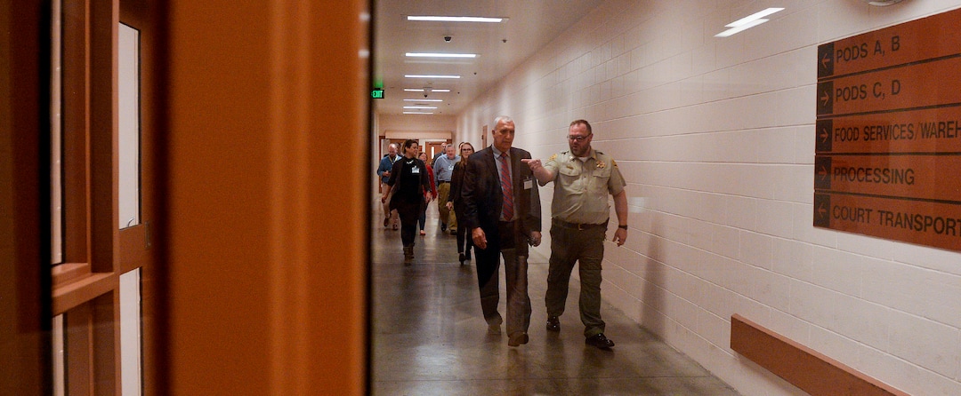 (Leah Hogsten  |  The Salt Lake Tribune) “This is about us becoming fully aware of the role we play in the system, “ said Salt Lake County District Attorney Sim Gill, left, as he toured the Salt Lake County Jail with eight employees led by Salt Lake County Sheriff Department’s Captain Corey Kiddle, Dec. 6, 2019.  Gill is pushing for the roughly 100 attorneys under his leadership throughout Salt Lake County and the district attorney’s office to visit the correctional facilities in which individuals prosecuted by their office are placed.