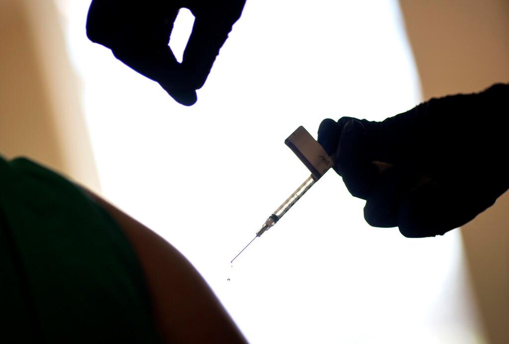 (David Goldman | AP) In this Tuesday, Dec. 15, 2020 file photo, a droplet falls from a syringe after a health care worker is injected with the Pfizer-BioNTech COVID-19 vaccine at Women & Infants Hospital in Providence, R.I. The Vatican has declared it “morally acceptable” for Roman Catholics to receive COVID-19 vaccines based on research that used fetal tissue from abortions. The Vatican’s watchdog office for doctrinal orthodoxy said Monday that it addressed the question after receiving requests for guidance.