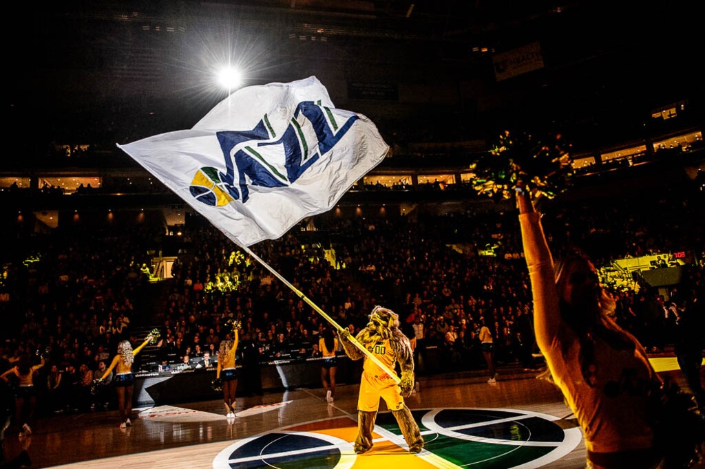 (Trent Nelson | The Salt Lake Tribune) Jazz Bear waves a flag before a game in 2017.