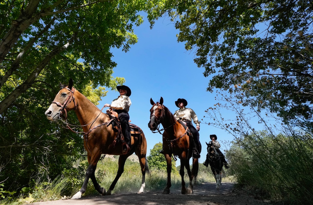 (Francisco Kjolseth | The Salt Lake Tribune) The Mounted Posse for the Salt Lake County Sheriffs Office arrives to celebrate the ribbon cutting of Butterfield Trailhead Regional Park on Thursday, Aug. 31, 2023. Open to multiple users—hikers, equestrians, trail runners, and mountain bikers—the new park in the Oquirrhs offers 14 miles of trail with plans for expansion south of the Kennecott mine.