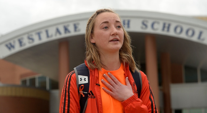 (Al Hartmann  |  The Salt Lake Tribune) 	
Kaylee Anderson organized about 80 students at Westlake High School in Saratoga Springs that  stood together in silence at the front entrance of the school Wednesday March 14, 2018 to remember the 17 students who died in a school shooting in Florida.  They held posters of the names of those killed. 