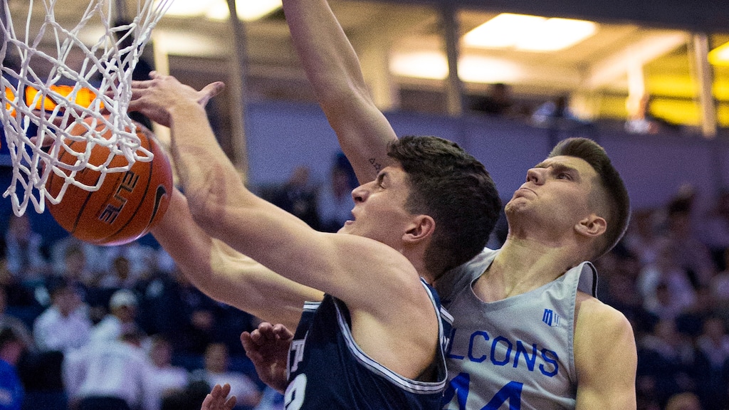 Air Force guard Chris Joyce, left, Utah State center Trevin Dorius (32) and Air Force guard Keaton Van Soelen (44) vie for a rebound during the first half of an NCAA college basketball game Tuesday, Jan. 7, 2020, at Air Force Academy, Colo. (Christian Murdock/The Gazette via AP)