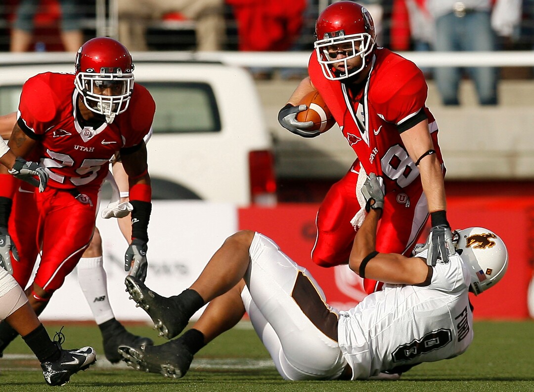 (Chris Detrick  |  Tribune File Photo)  Utah's Steve Tate runs through Wyoming's Brian Hendricks during the game on November 10, 2007 at Rice-Eccles Stadium.Utah won 50-0.