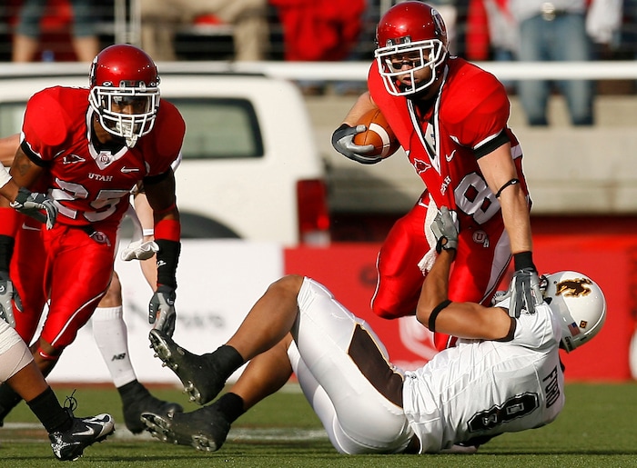 (Chris Detrick  |  Tribune File Photo)  Utah's Steve Tate runs through Wyoming's Brian Hendricks during the game on November 10, 2007 at Rice-Eccles Stadium.
Utah won 50-0.