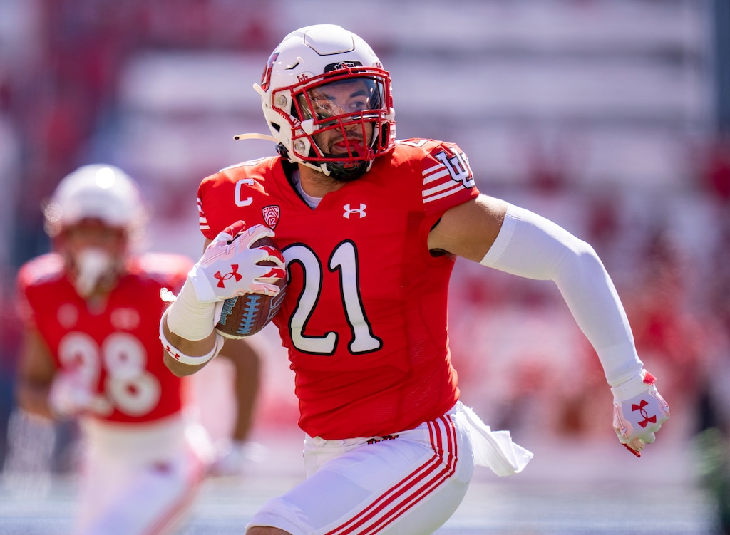 (Rick Egan | The Salt Lake Tribune)  Utah Utes linebacker Karene Reid (21) runs for a touchdown on a pick-six on the second play of the game, in PAC-12  football action between the Utah Utes and theUCLA Bruins, at Rice-Eccles Stadium, on Saturday, Sept. 23, 2023.