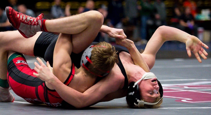 (Trent Nelson | The Salt Lake Tribune)  Bountiful's Jonathan Hansen and West's Duncan Arnold (right), 5A State Championships, high school wrestling quarterfinals in Orem, Wednesday February 7, 2018.