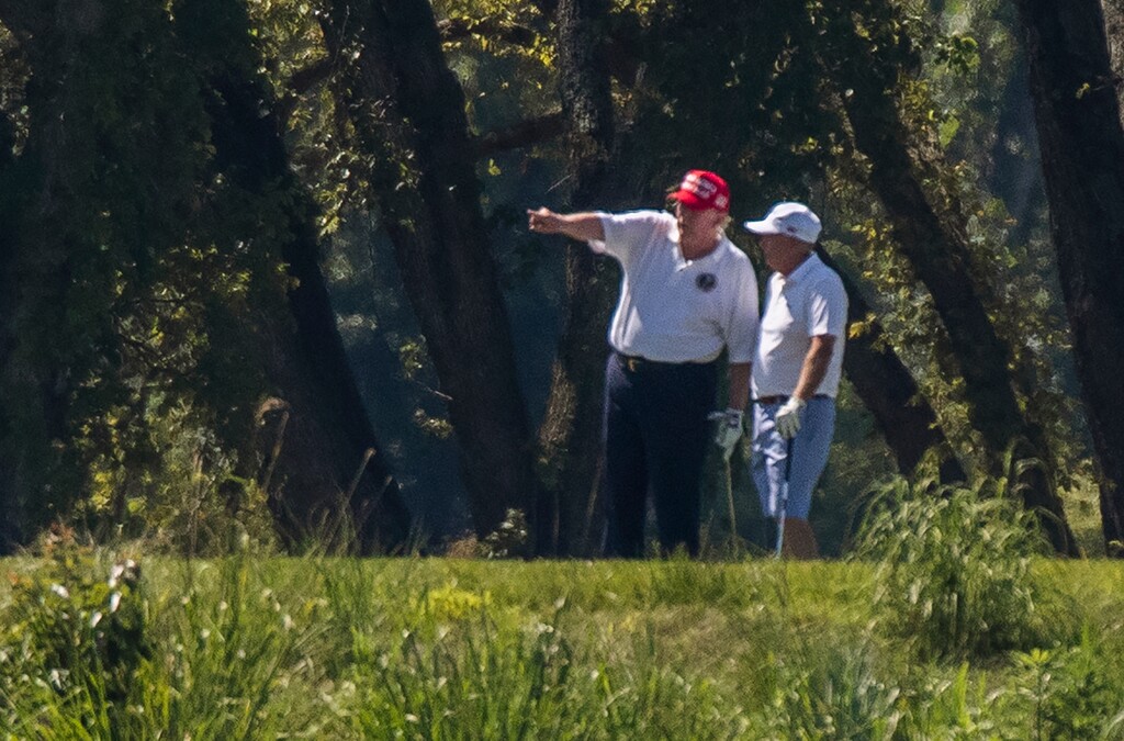 (Manuel Balce Ceneta | AP photo)

President Donald Trump and Sen. Lindsey Graham, R-S.C., right, play golf at Trump National Golf Club in Sterling, Va., as seen from the other side of the Potomac River in Darnestown, Md., Saturday, July 18, 2020.