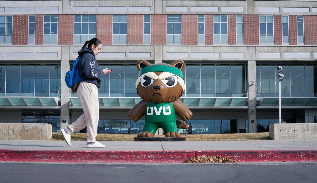 (Bethany Baker | The Salt Lake Tribune) A student walks on campus at Utah Valley University in Orem on Wednesday, Dec. 11, 2024. UVU is set to see its budget cut by $8.9 million with a move by Utah lawmakers to slash and reallocate funding across higher education this session.