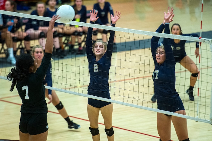(Chris Detrick | The Salt Lake Tribune) Skyline's Kiana Crawford (17) and Skyline's Gabby Latteier (2) go up to block West's Dana Manu (7) during the volleyball match at West High School Tuesday, October 3, 2017.