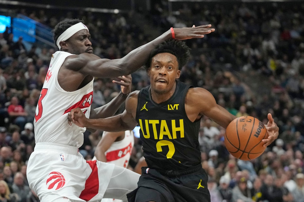 (Rick Bowmer | AP) Toronto Raptors forward Pascal Siakam, left, defends against Utah Jazz guard Collin Sexton (2) during the first half of an NBA basketball game Friday.